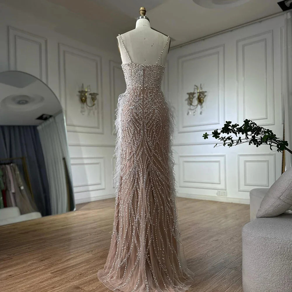 Luxury Dubai Arabic White Nude Spaghetti Strap Feathers Beaded Mermaid Evening Gown for Formal Occasion LA72823